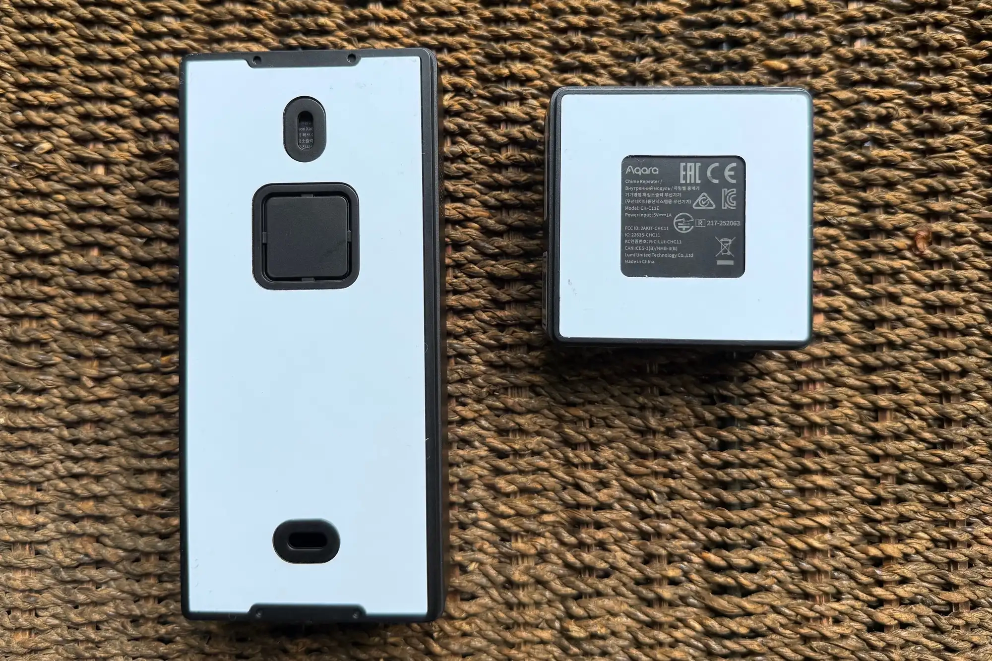 Backsides of Aqara Doorbell Camera Hub G410 and chime