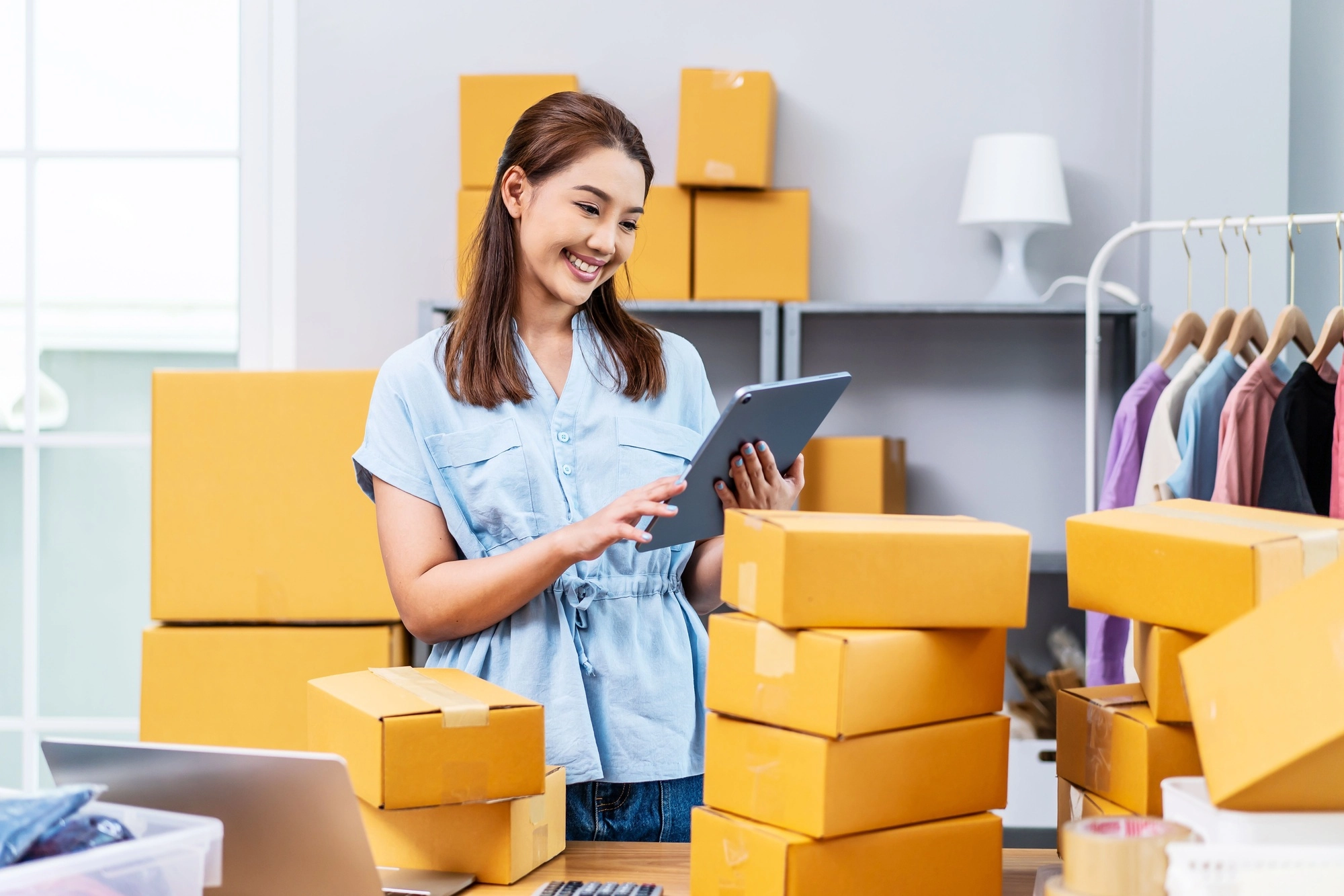 Young female owner startup received orders from clients and selling