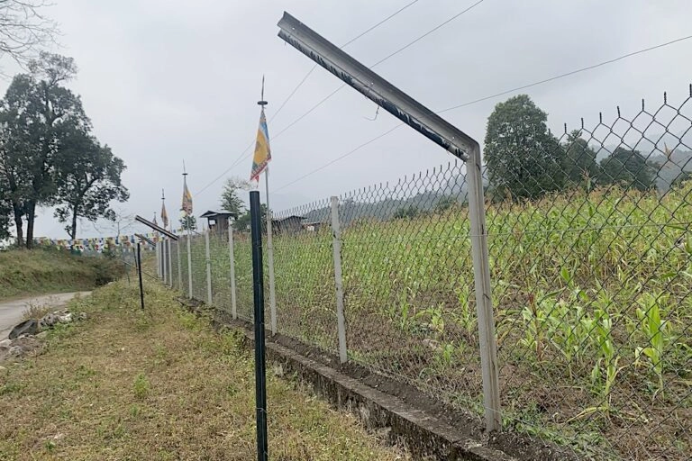A section of chain-link fence installed in Singye Gewog, Sarpang district