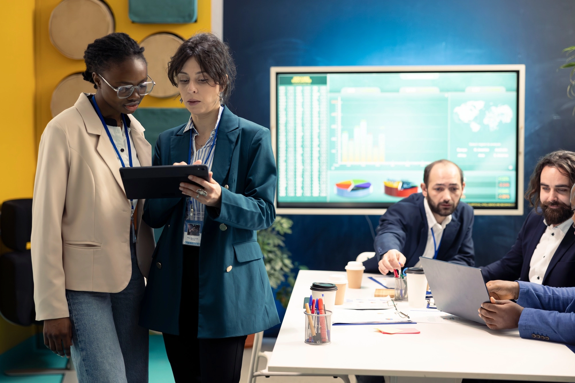 Business colleagues examining success and efficiency metrics