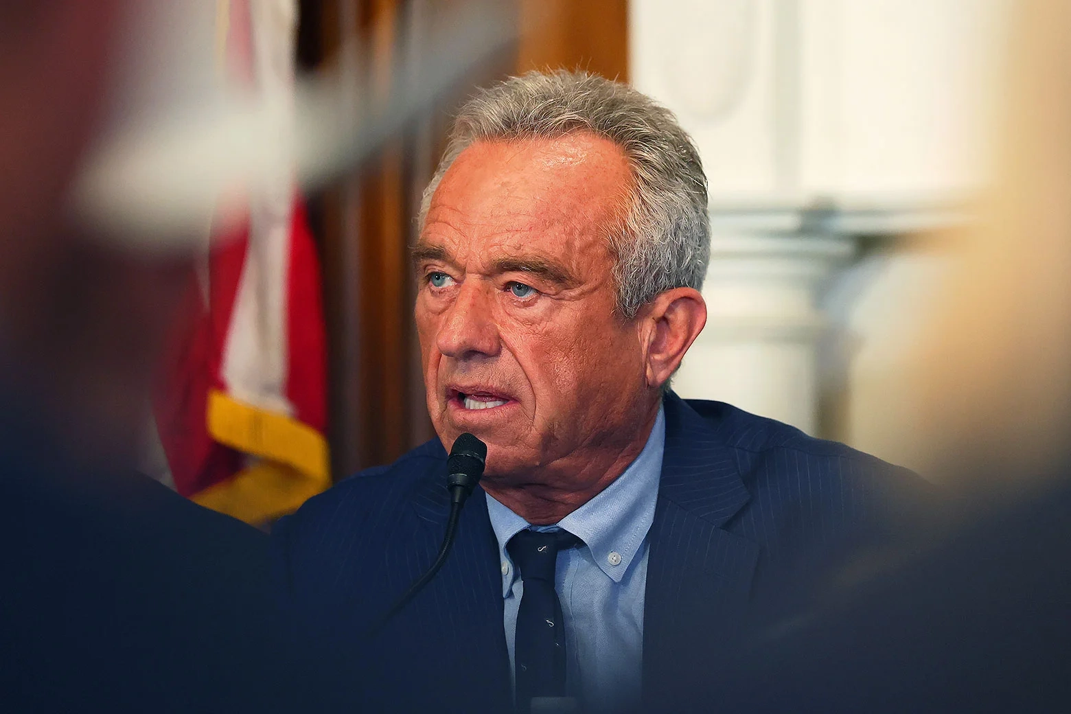 RFK Jr. speaks into a mic.