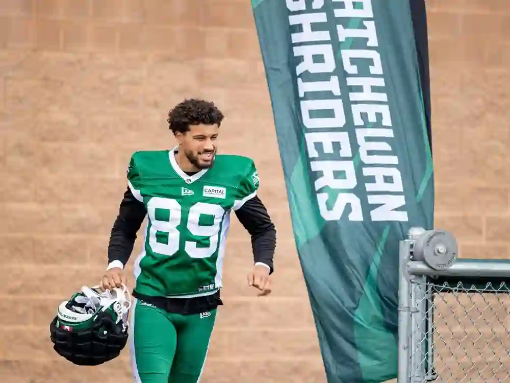 Saskatchewan Roughriders wide receiver Kian Schaffer-Baker runs on field for the Green and White Day scrimmage.