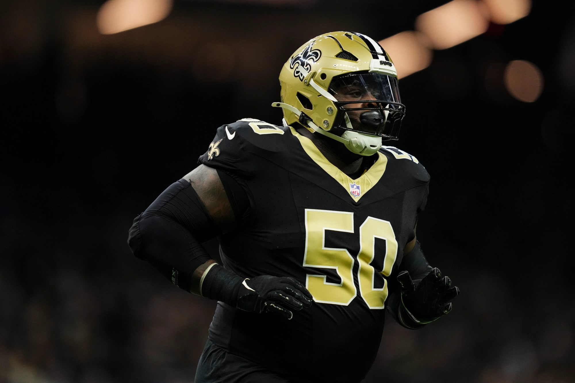 NEW ORLEANS, LA - DECEMBER 01: Khalen Saunders #50 of the New Orleans Saints runs across the field during an NFL football game against the Los Angeles Rams at Caesars Superdome on December 1, 2024 in New Orleans, Louisiana. (Photo by Cooper Neill/Getty Images)