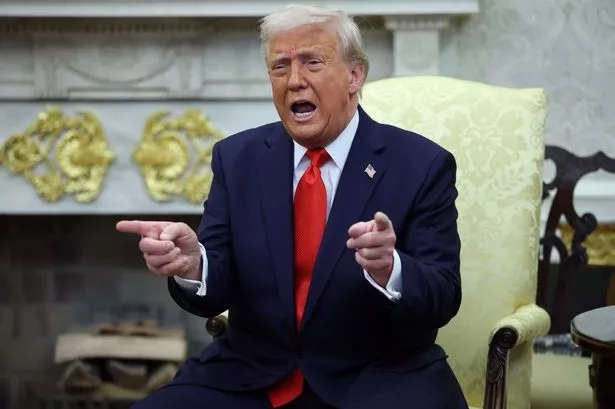 Donald Trump gestures as he meets with President Nayib Bukele of El Salvador in the Oval Office of the White House April 14, 2025 in Washington, DC.