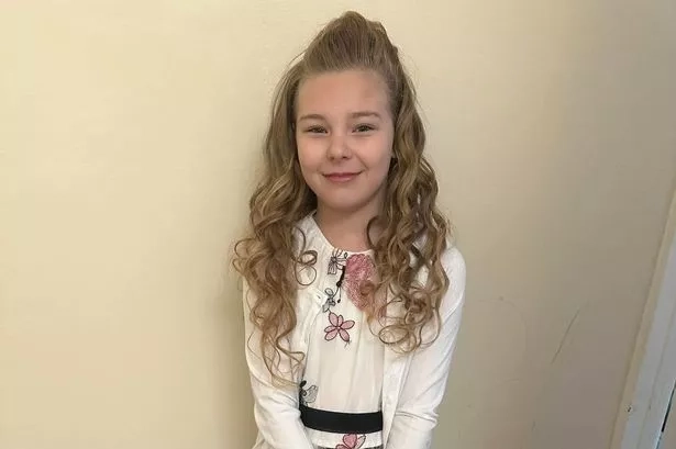  'Bullies tore her dress to pieces' according to her mum