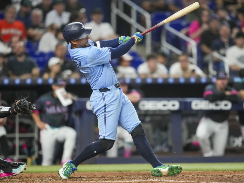 Blue Jays batter George Springer hits a home run during the seventh inning against the Marlins at loanDepot Park in Miami, Saturday, Aug. 23, 2025.