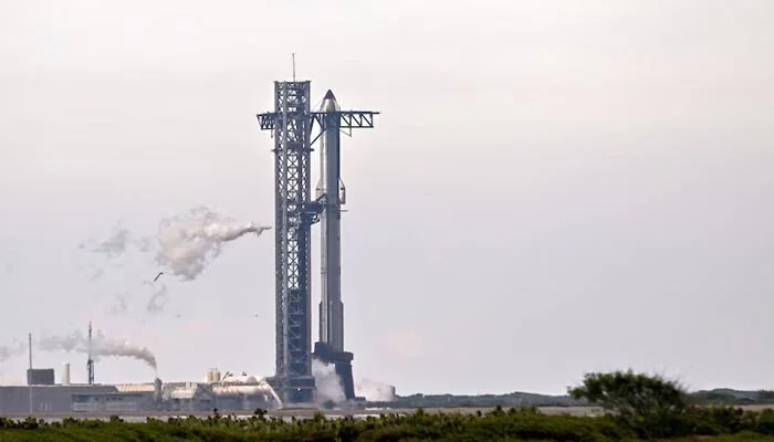 A SpaceX Super Heavy booster carrying the Starship spacecraft vents before the launch is scrubbed to allow for troubleshooting of a ground issue at the companys launch complex in Starbase, Texas, US, August 24, 2025.  Reuters