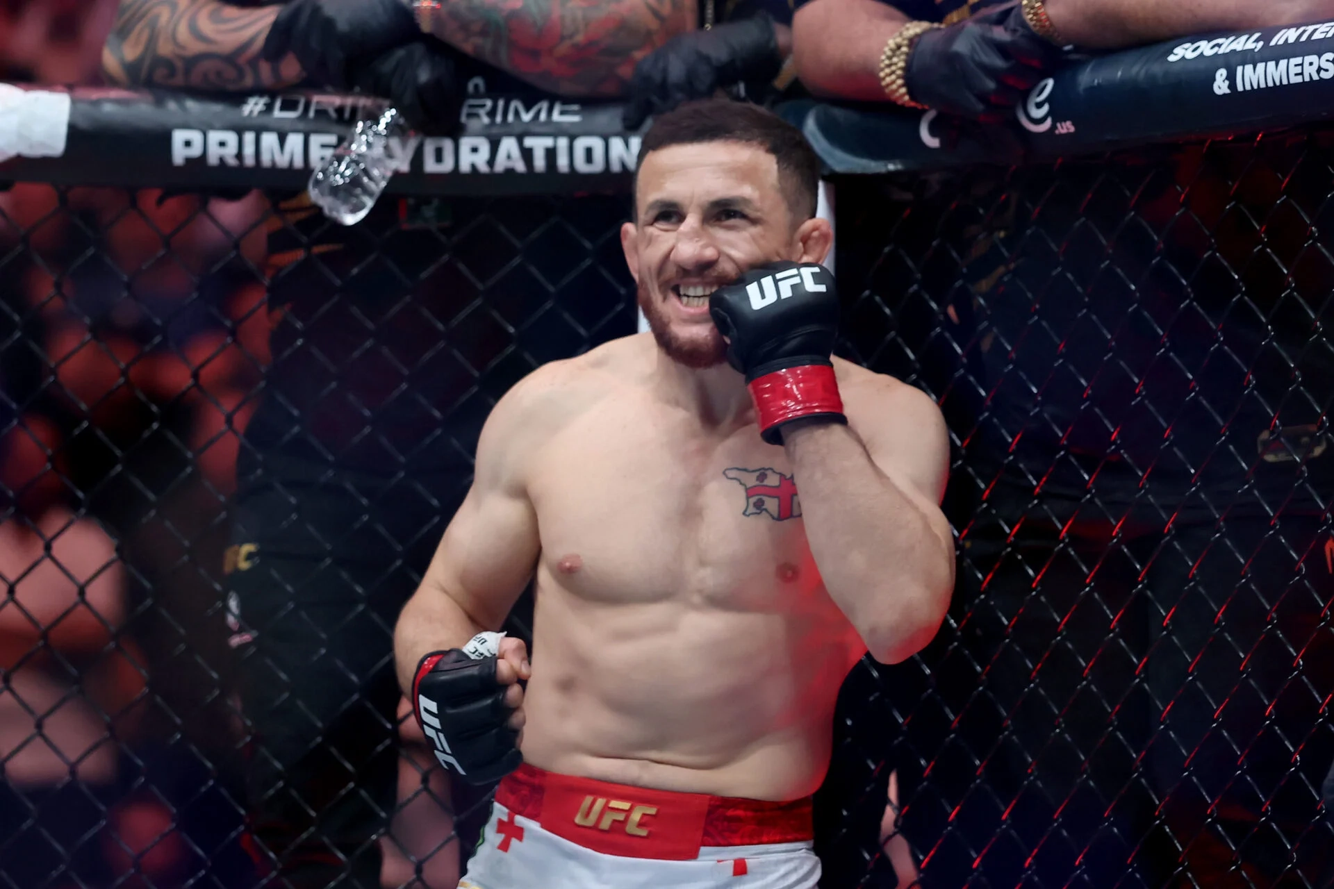 Image of Merab Dvalishvili smiling in the Octagon at UFC 316
