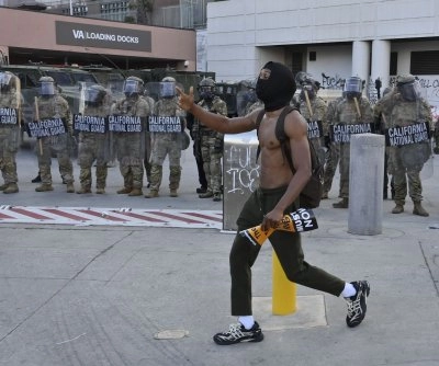 Los Angeles Protest Turns Confrontational with Police Deployment of Pepper Spray and Munitions