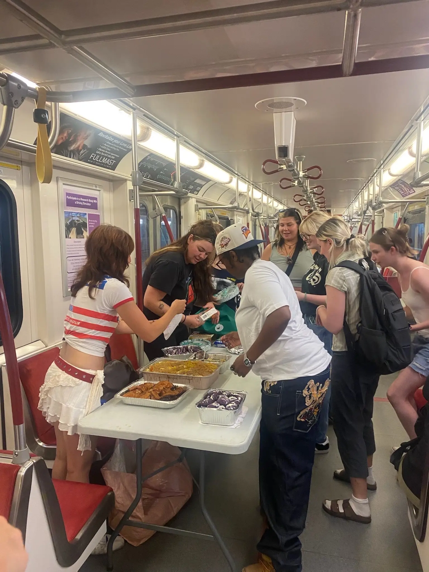 Toronto Woman Hosts Free Buffet on TTC Subway, Goes Viral